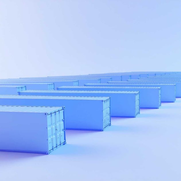 An array of blue shipping containers lined up into the distance