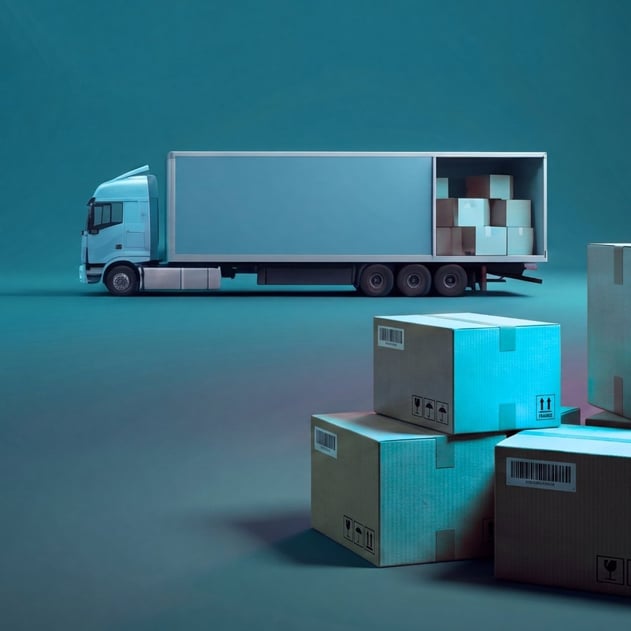 A shipping truck with cardboard boxes in the foreground