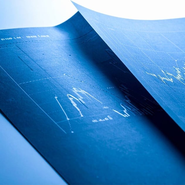 Dark blue graphs on pieces of paper