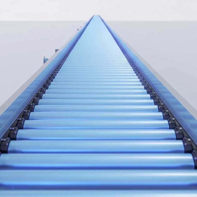 An empty blue production line rolling into the distance
