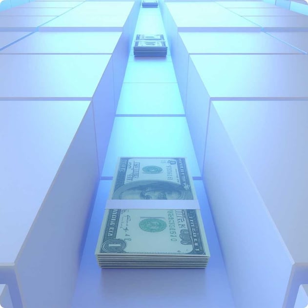 A stack of dollars moving through a series of blocks