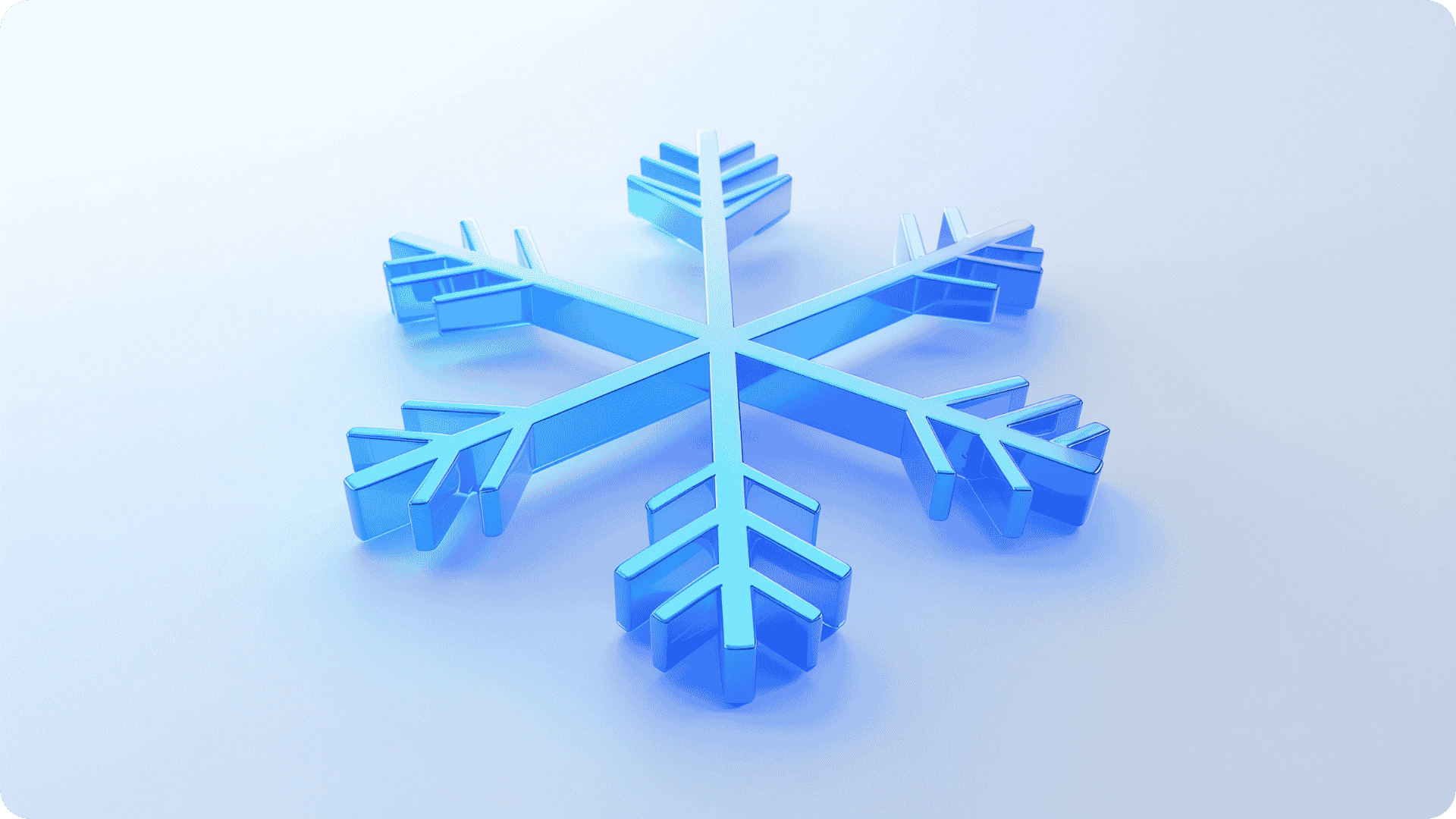 A light blue snowflake on a plain background